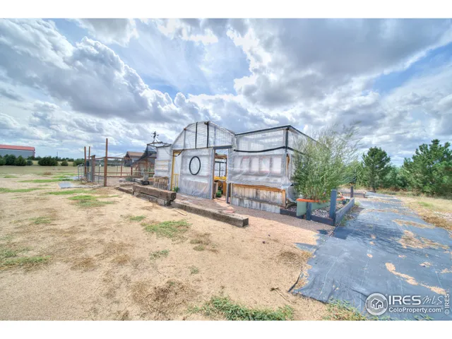a view of a swimming pool with an outdoor seating