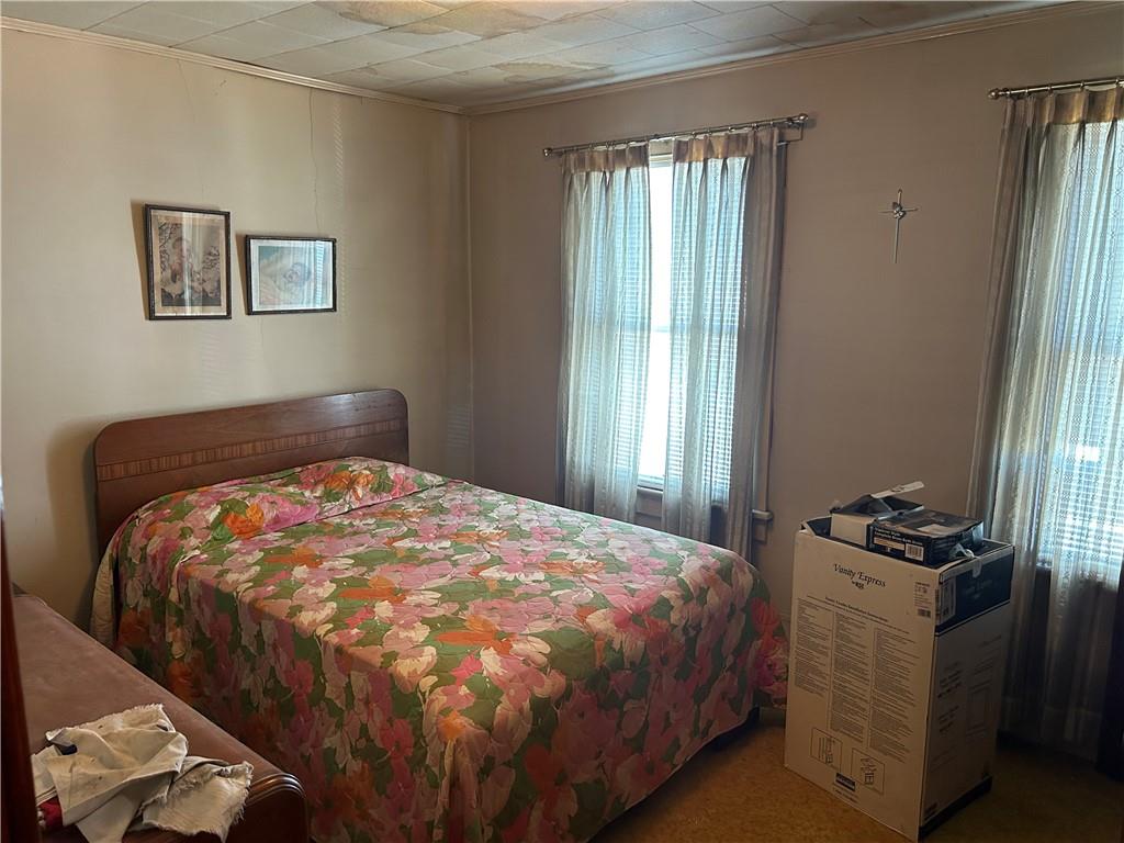 102 East 2nd Street Grindstone, PA 15442 - Photo 11 of 20 a bedroom with a bed and a window