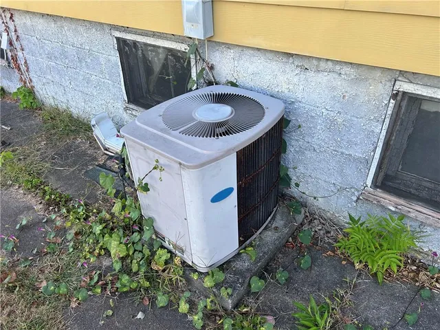 a view of a house with backyard and porch