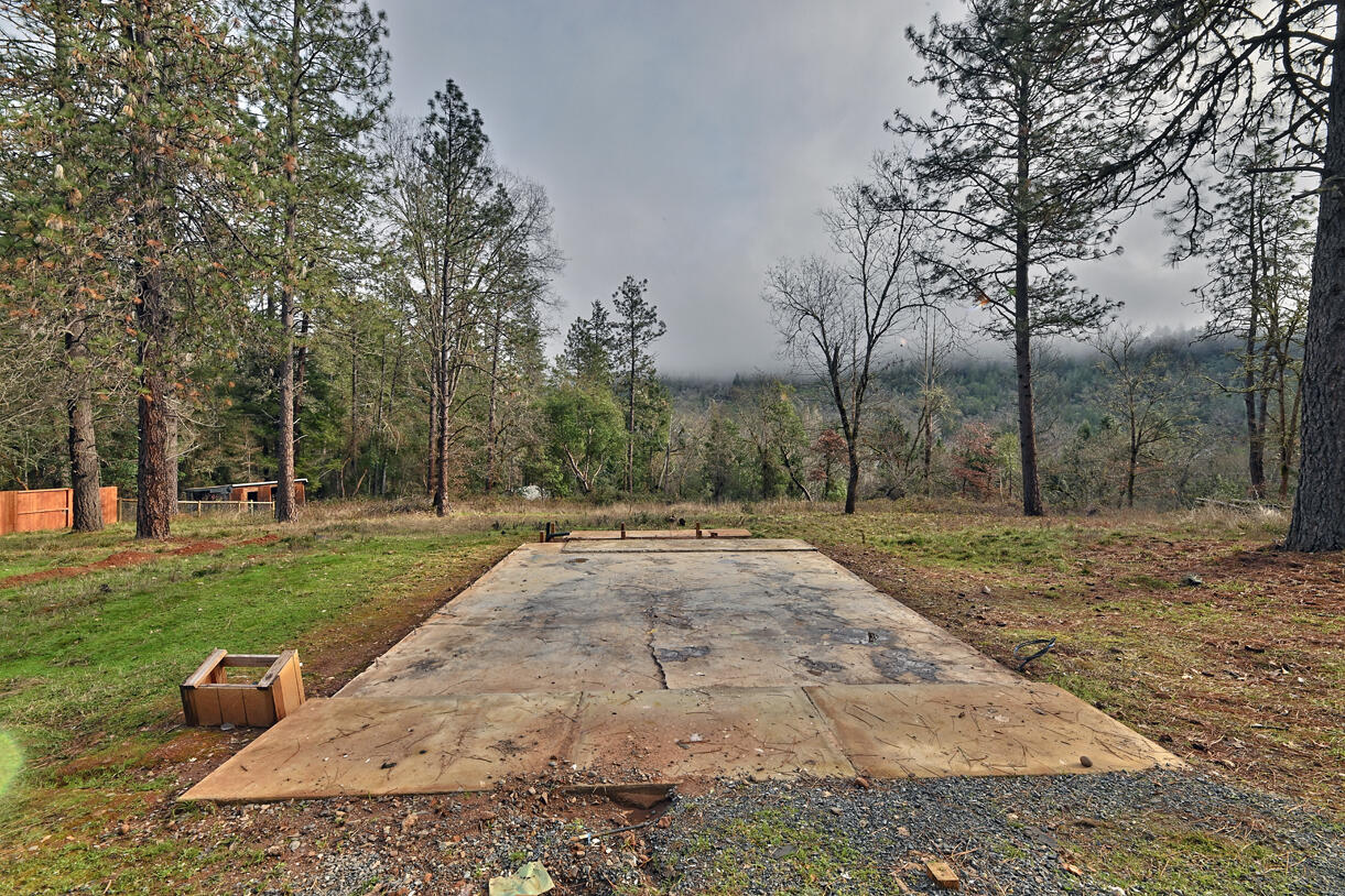 1329 West Evans Creek Road Rogue River, OR 97537 - Photo 3 of 23 a view of a park with large trees