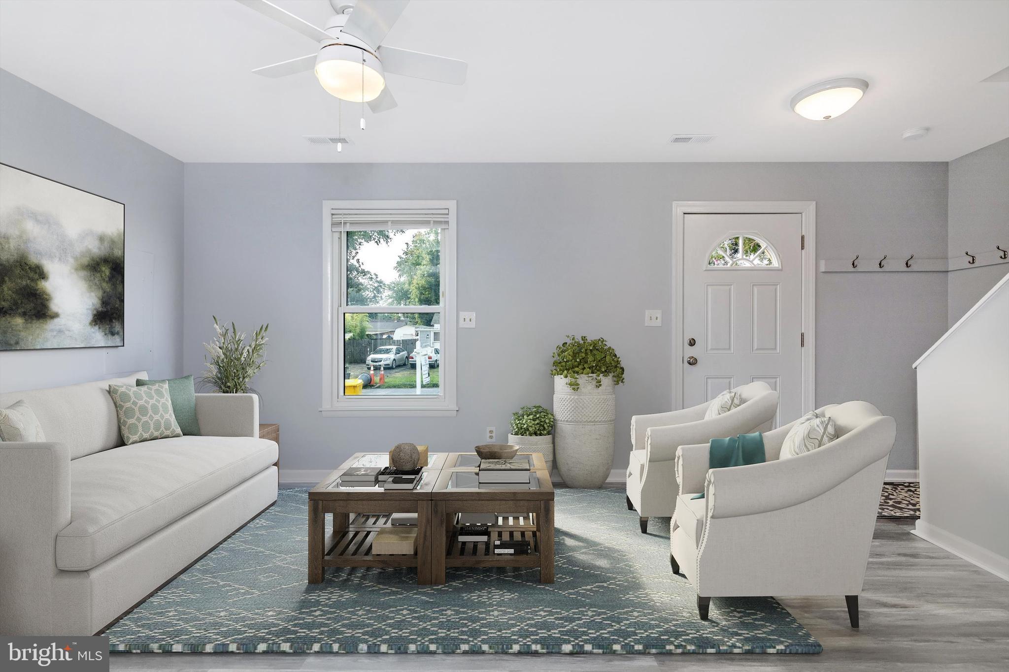 1702 Potomac Road Edgewater, MD 21037 - Photo 2 of 41 a living room with furniture a window and a table