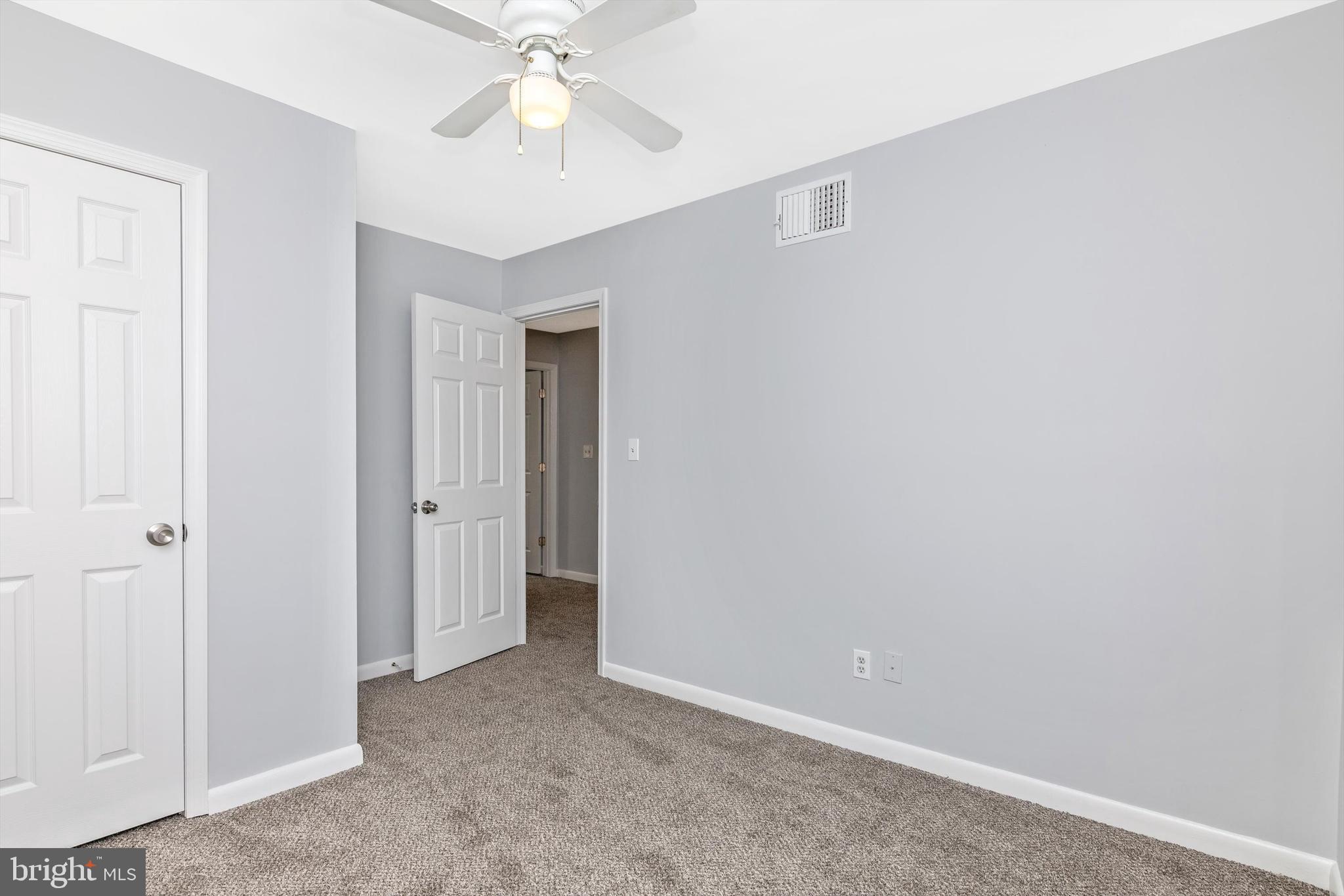 1702 Potomac Road Edgewater, MD 21037 - Photo 12 of 41 a view of an empty room with a chandelier fan