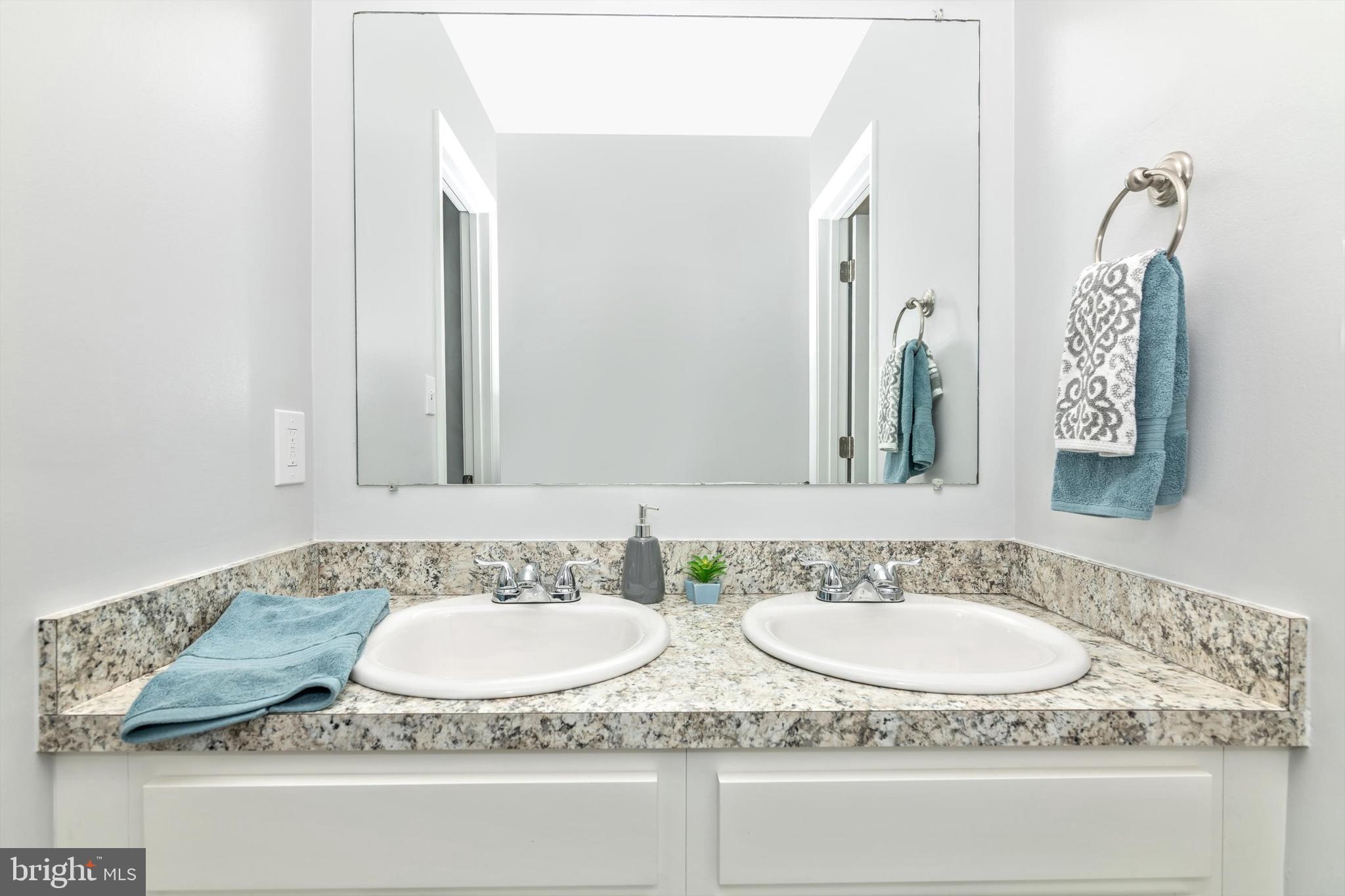 1702 Potomac Road Edgewater, MD 21037 - Photo 15 of 41 a bathroom with a granite countertop sink and a mirror
