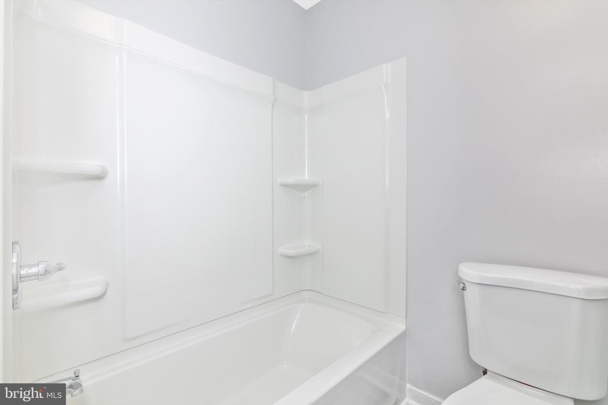 1702 Potomac Road Edgewater, MD 21037 - Photo 16 of 41 a white bath tub sitting next to a white toilet