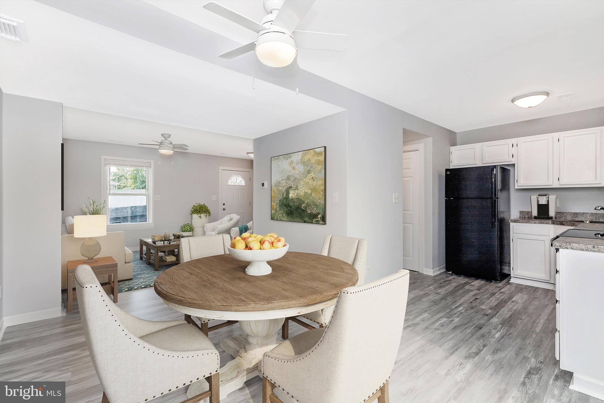1702 Potomac Road Edgewater, MD 21037 - Photo 3 of 41 a kitchen with a dining table and chairs