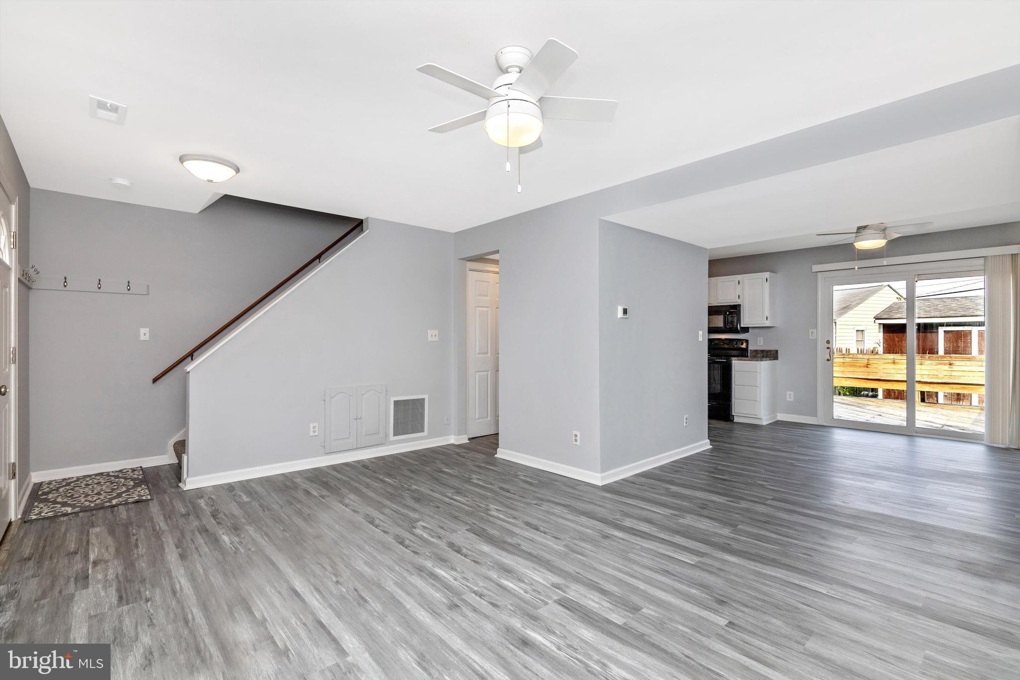 1702 Potomac Road Edgewater, MD 21037 - Photo 28 of 41 a view of an empty room with wooden floor and a ceiling fan
