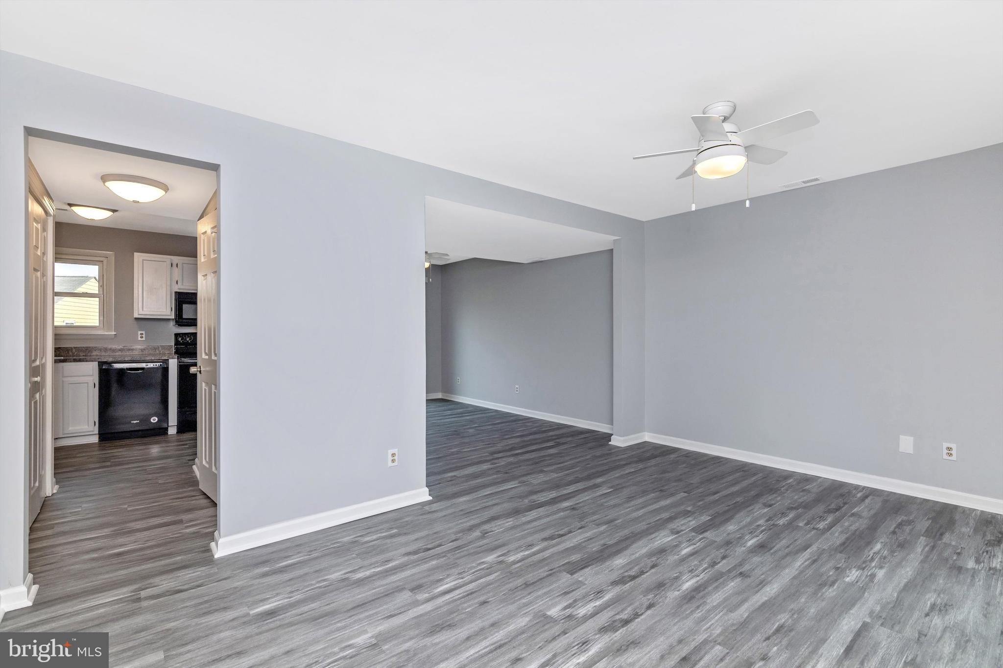 1702 Potomac Road Edgewater, MD 21037 - Photo 39 of 41 an empty room with wooden floor and entrance