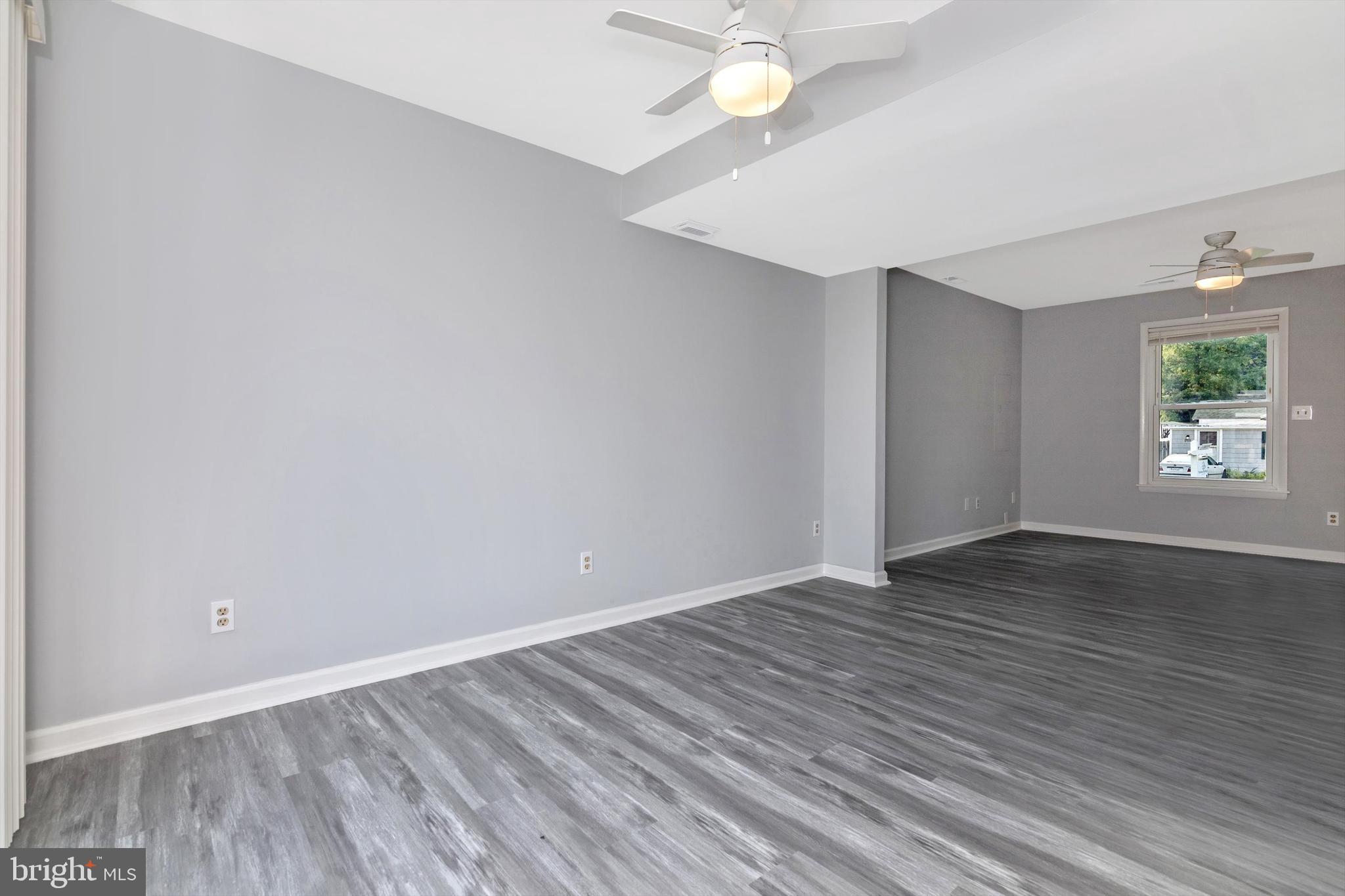 1702 Potomac Road Edgewater, MD 21037 - Photo 40 of 41 wooden floor in an empty room with a window