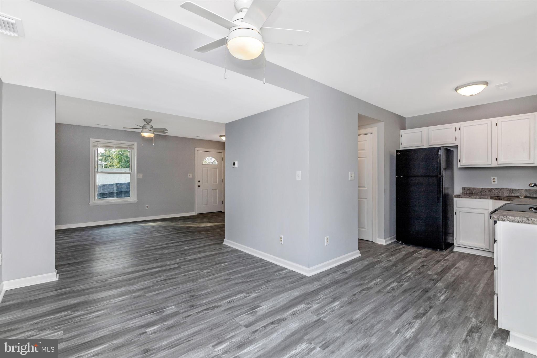 1702 Potomac Road Edgewater, MD 21037 - Photo 41 of 41 a view of empty room with wooden floor and window