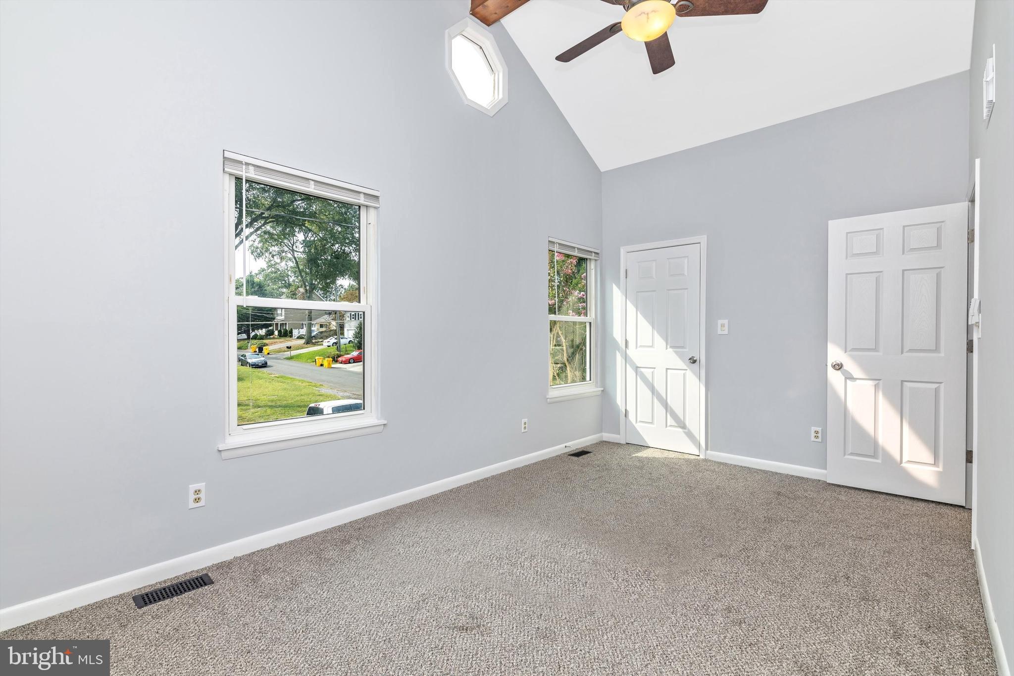 1702 Potomac Road Edgewater, MD 21037 - Photo 32 of 41 an empty room with chandelier fan and windows