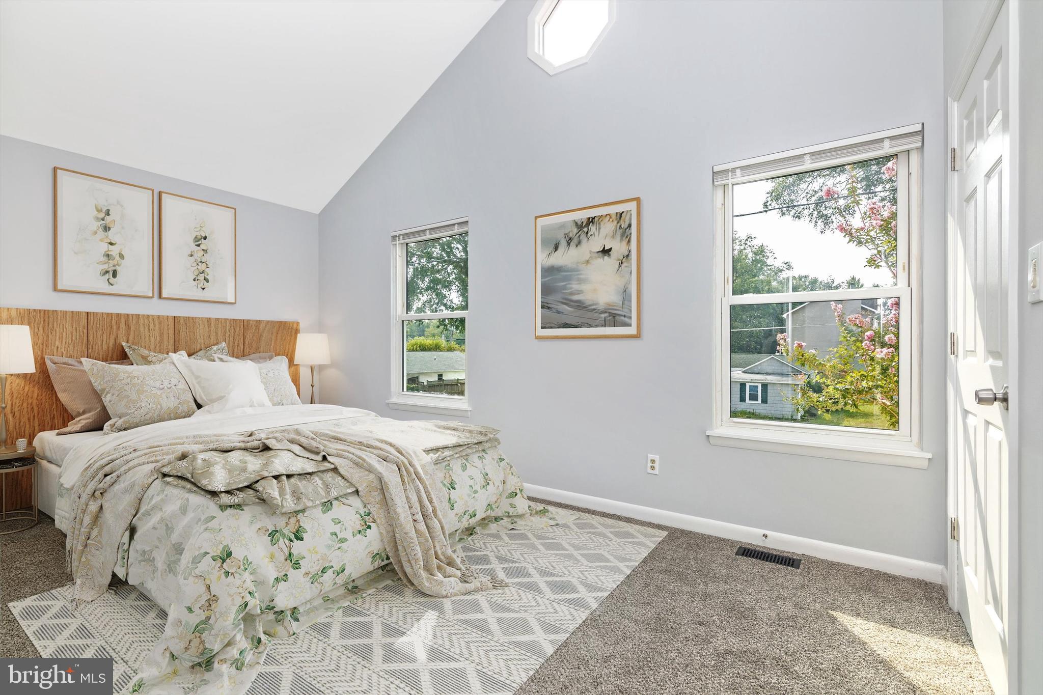 1702 Potomac Road Edgewater, MD 21037 - Photo 10 of 41 a bed sitting in a bedroom next to a window