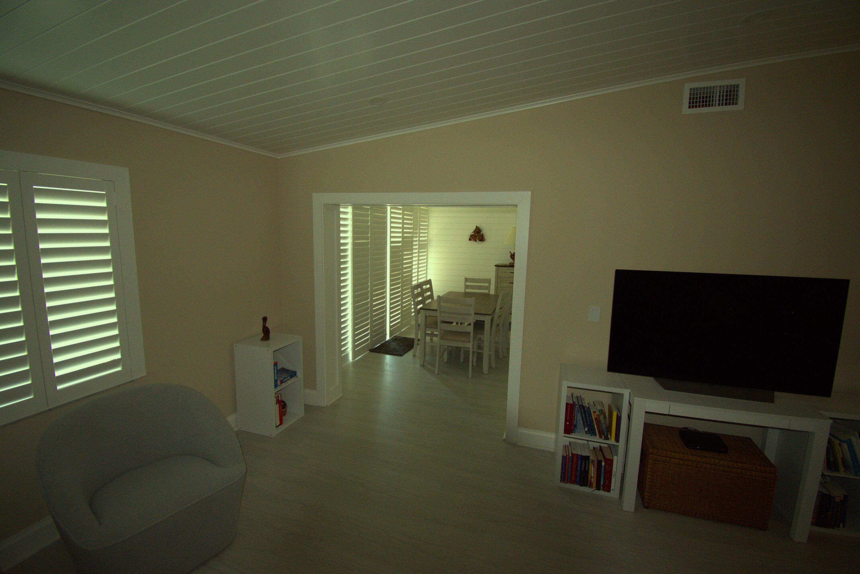 8103 Songbird Terrace Boca Raton, FL 33496 - Photo 11 of 39 a living room with furniture and a flat screen tv