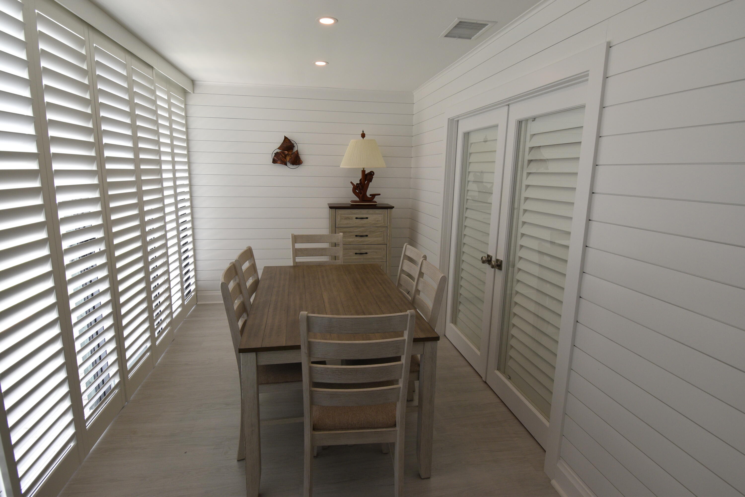 8103 Songbird Terrace Boca Raton, FL 33496 - Photo 12 of 39 a room with a chair and white walls