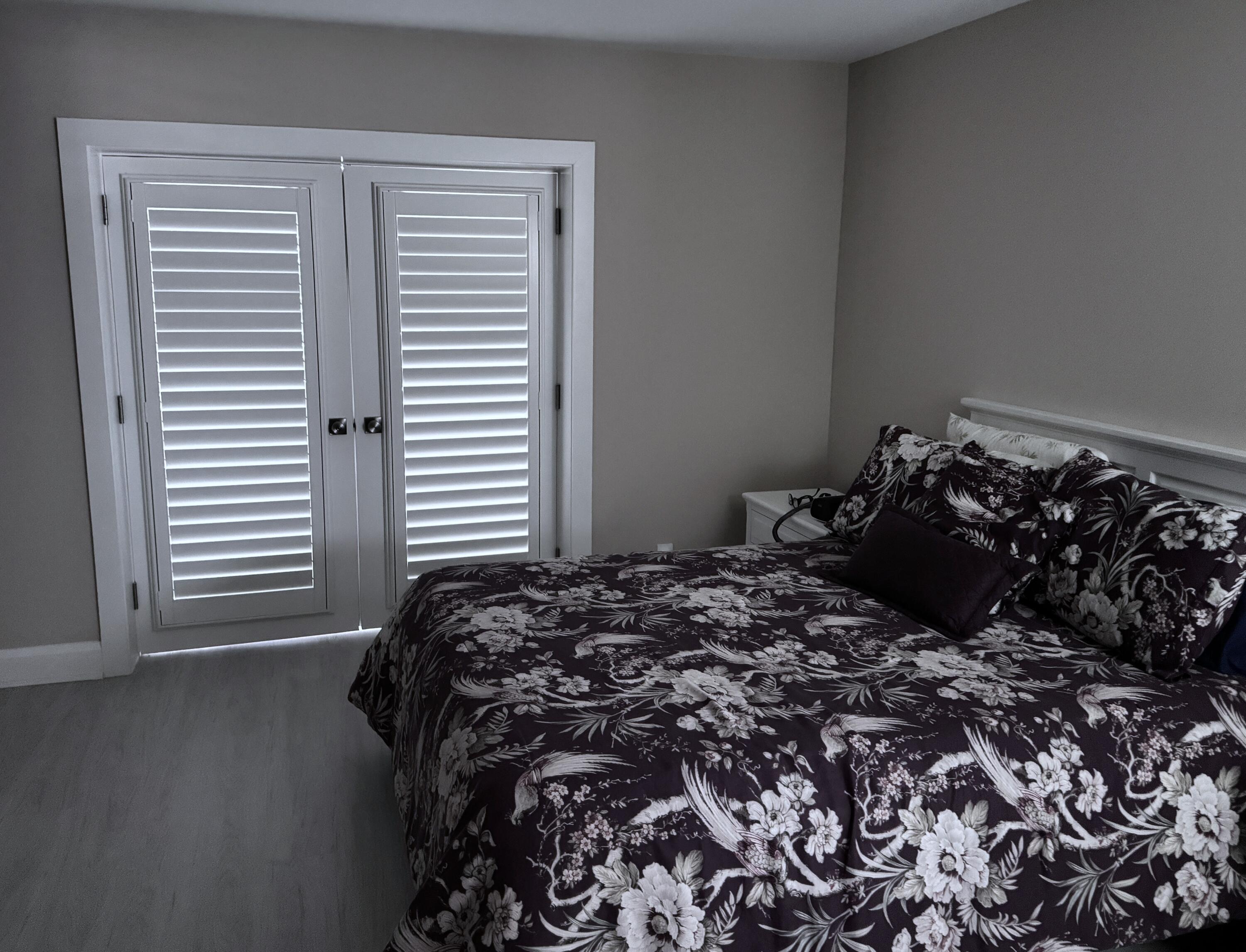 8103 Songbird Terrace Boca Raton, FL 33496 - Photo 18 of 39 a bed sitting in a bedroom next to a window