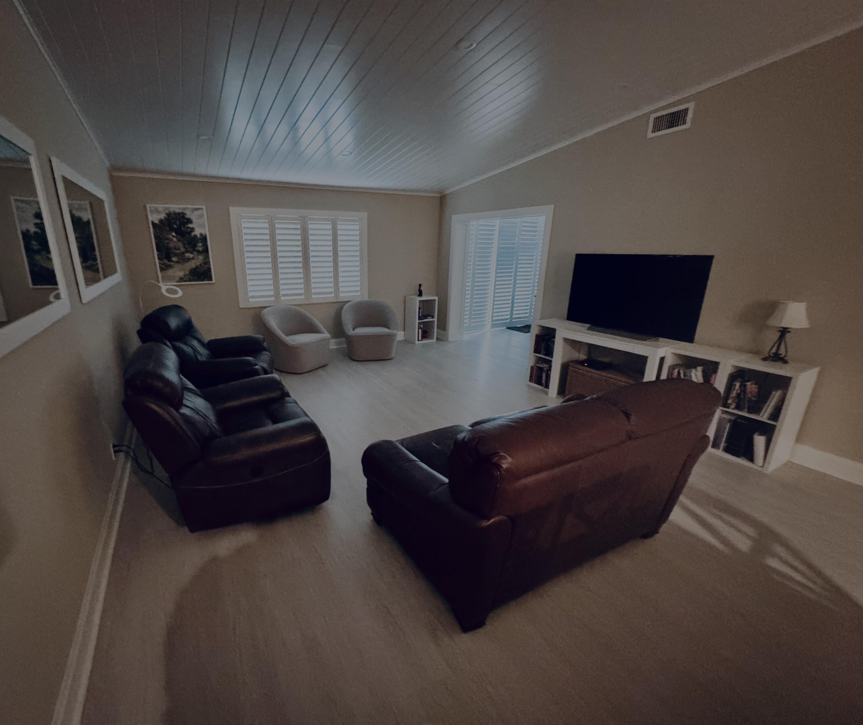 8103 Songbird Terrace Boca Raton, FL 33496 - Photo 9 of 39 a living room with furniture and a flat screen tv