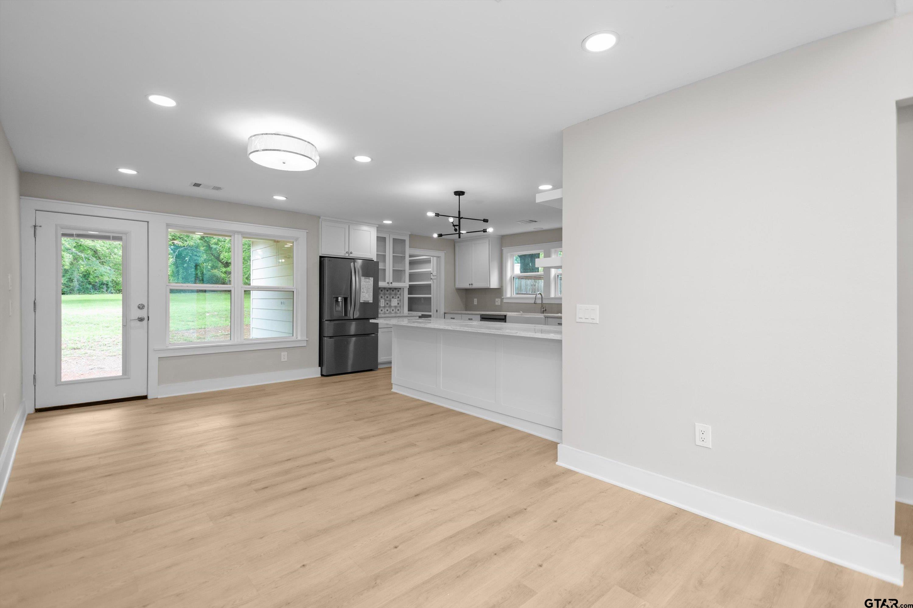 a view of a kitchen with a sink and a window
