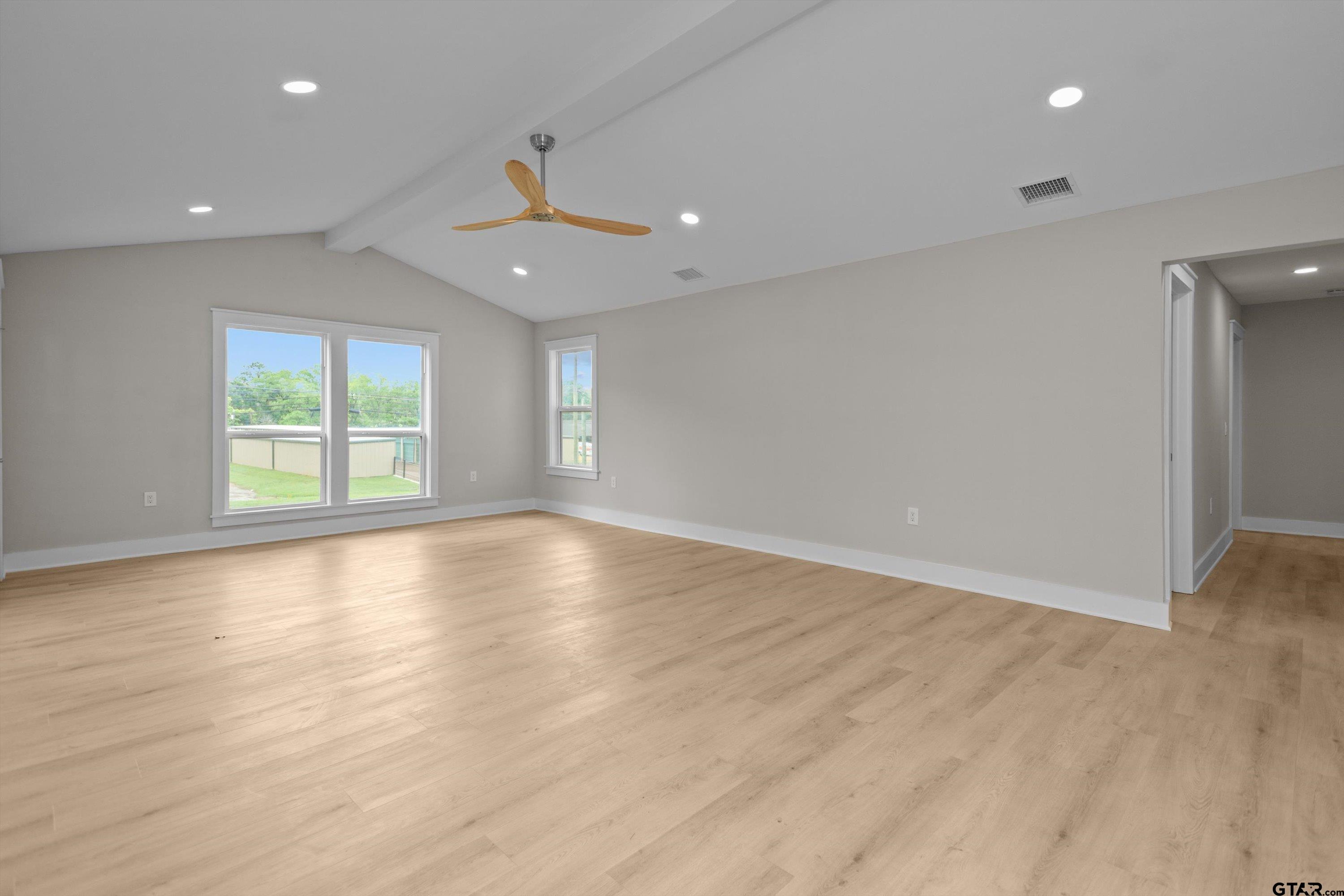 601 North 4th Street Crockett, TX 75835 - Photo 25 of 25 an empty room with wooden floor and windows
