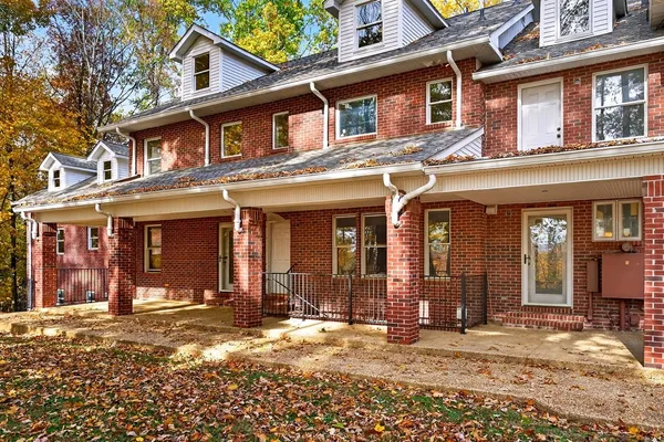a view of staircase with white walls