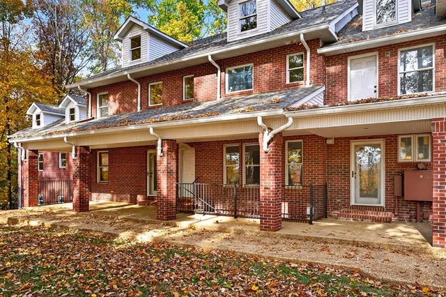 a view of staircase with white walls
