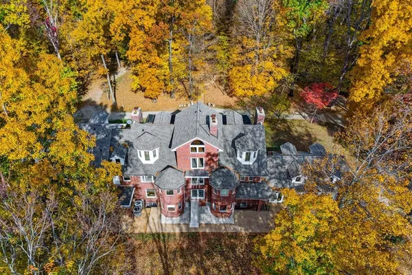 a front view of a house with a yard table and chairs