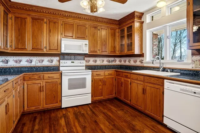 a view of a room with a wooden floor and door