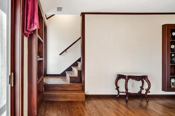 a view of an empty room with a fireplace