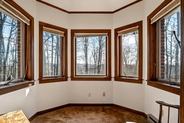 a front view of a house with yard outdoor seating and barbeque oven