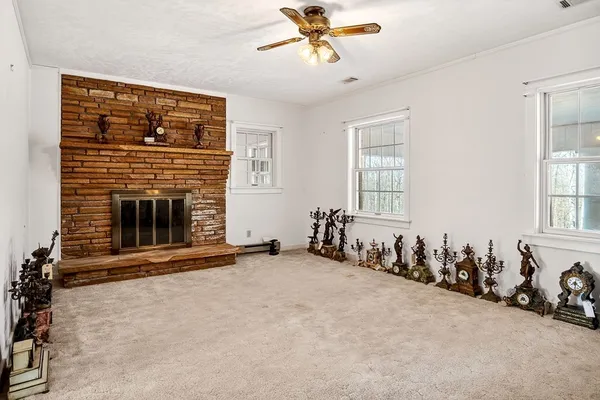 a view of a brick house with large windows