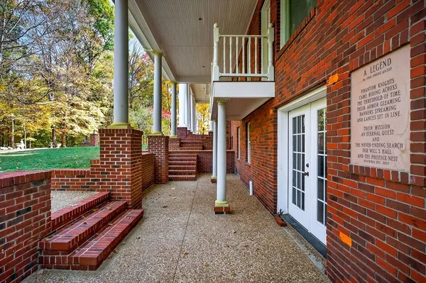 an aerial view of a house with outdoor space