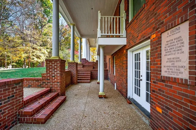 an aerial view of a house with outdoor space