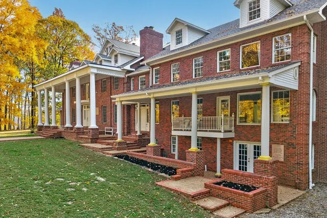 a aerial view of residential houses with outdoor space