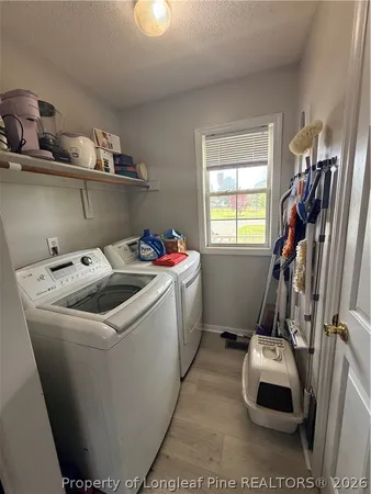 a utility room with washer and dryer