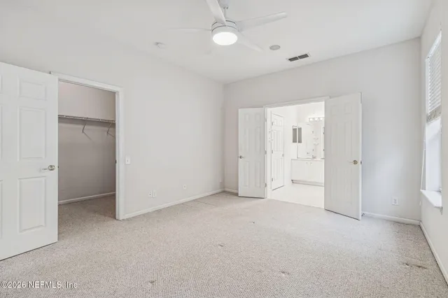 a bathroom with a shower and a toilet