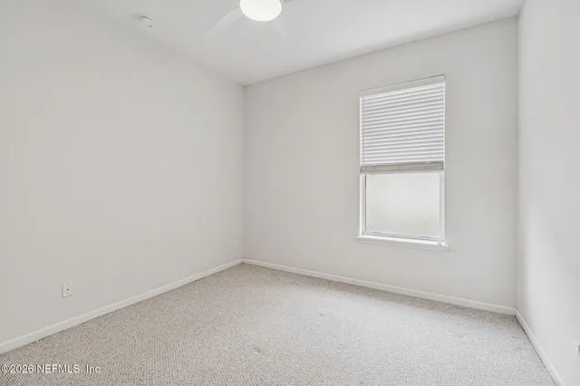 a bath room with a toilet sink and a shower