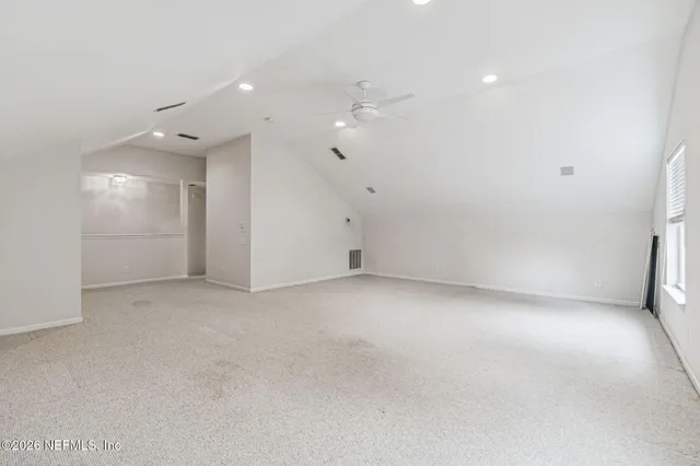 a view of a house with a yard and plants