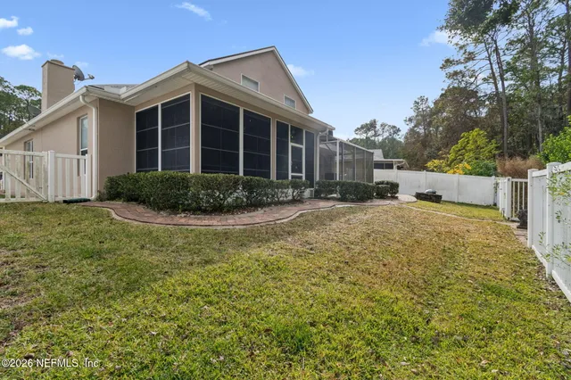 a view of a terrace with a table and chairs
