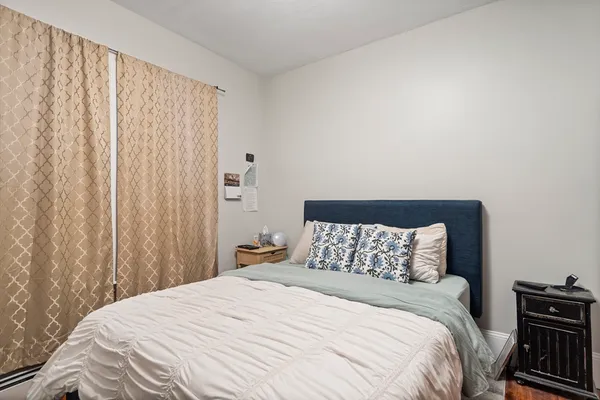 a bedroom with a bed and a cabinets