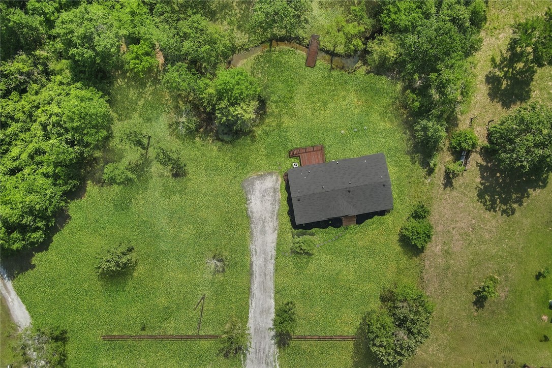 12796 South Fork Road Iola, TX 77861 - Photo 27 of 28 Aerial view of property with driveway, side and front yard and front wooden fence