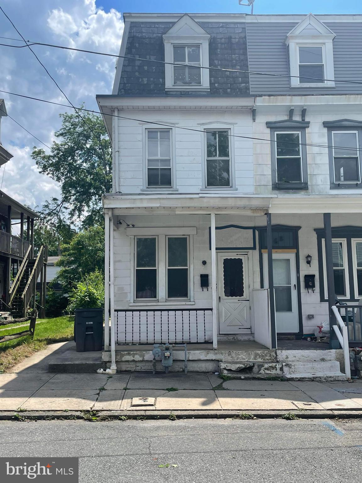60 West 3rd Street Pottstown, PA 19464 - Photo 1 of 13 a view of a brick house with large windows and plants