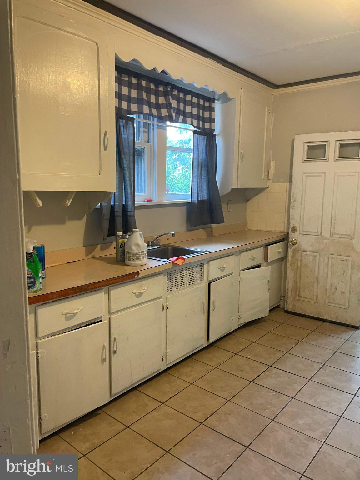 60 West 3rd Street Pottstown, PA 19464 - Photo 11 of 13 a kitchen with a sink cabinets and window