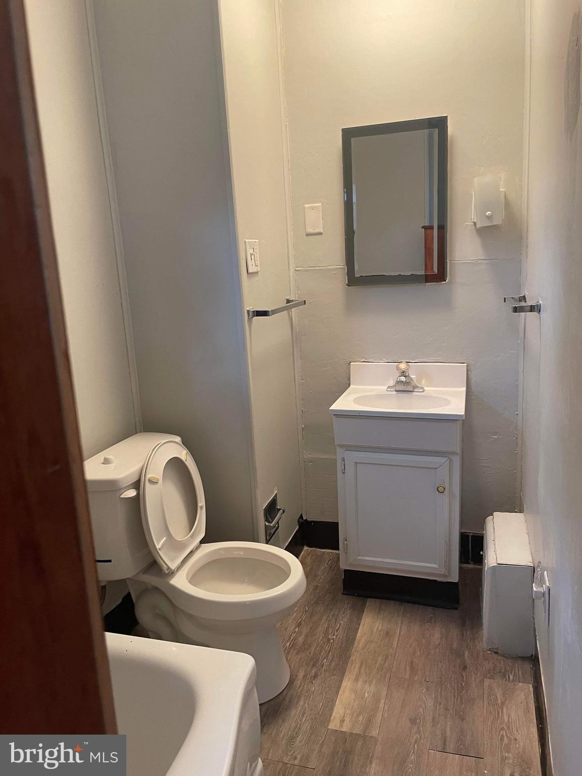 60 West 3rd Street Pottstown, PA 19464 - Photo 12 of 13 a bathroom with a toilet a sink and mirror
