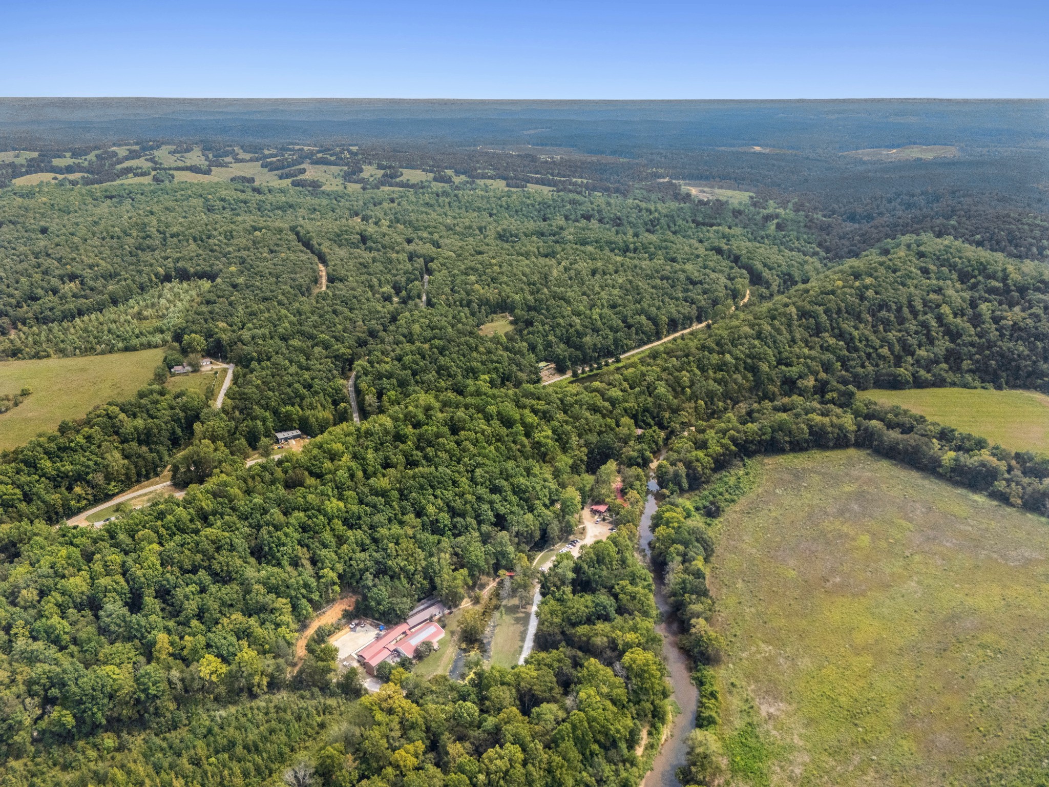 299 Natural Bridge Park Road Waynesboro, TN 38485 - Photo 16 of 63 an aerial view of a houses with a yard