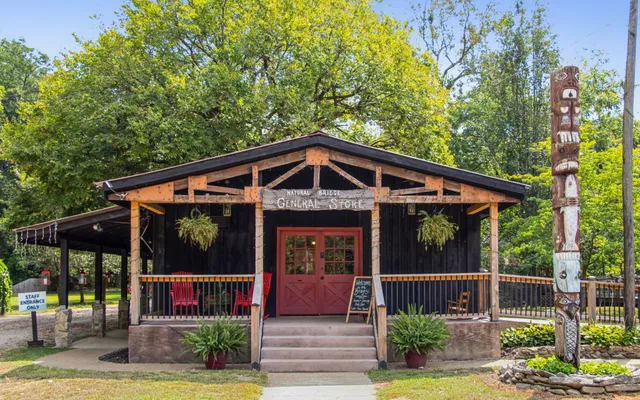 a view of a house with backyard and porch
