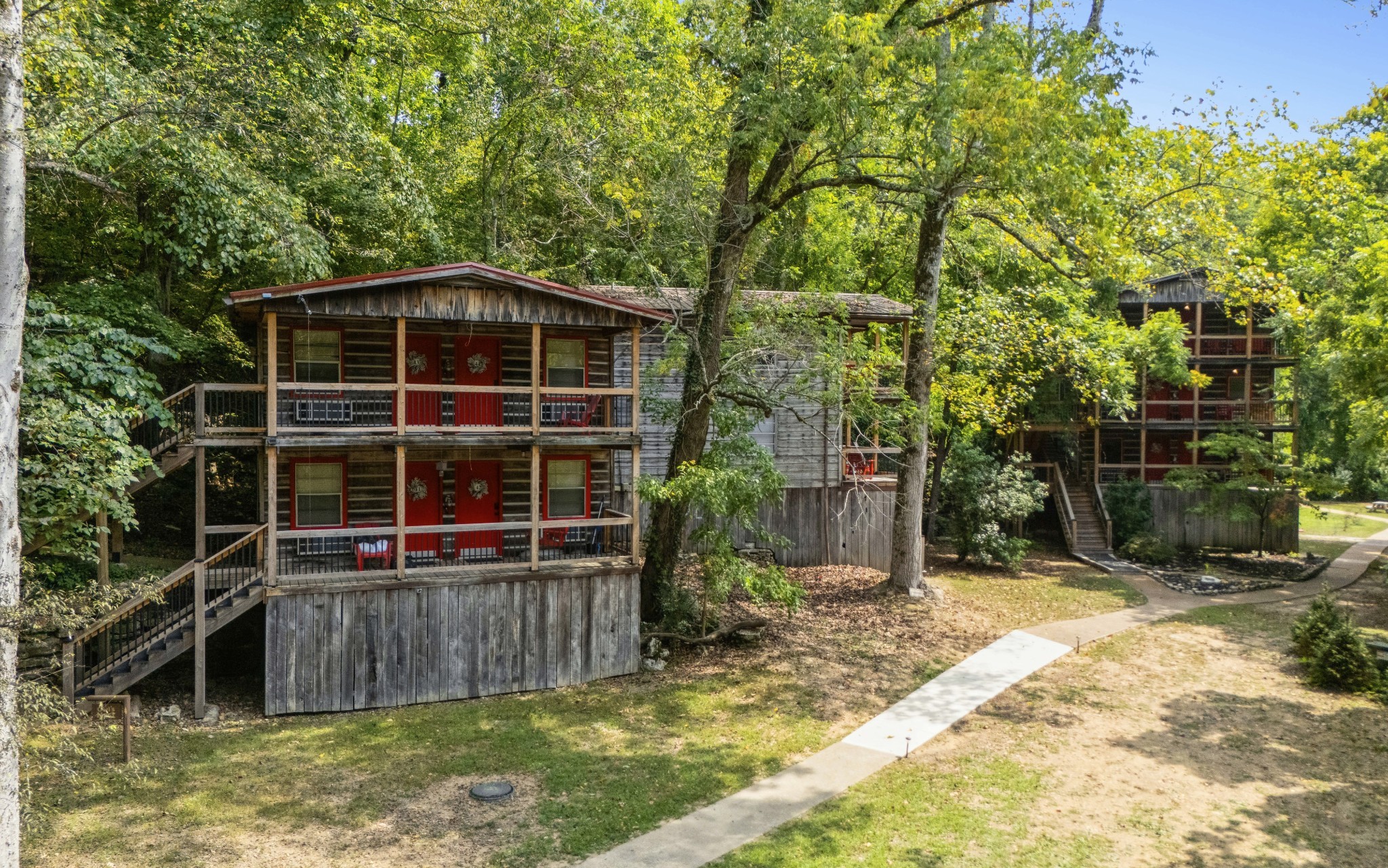 299 Natural Bridge Park Road Waynesboro, TN 38485 - Photo 36 of 63 a view of a backyard with a large tree