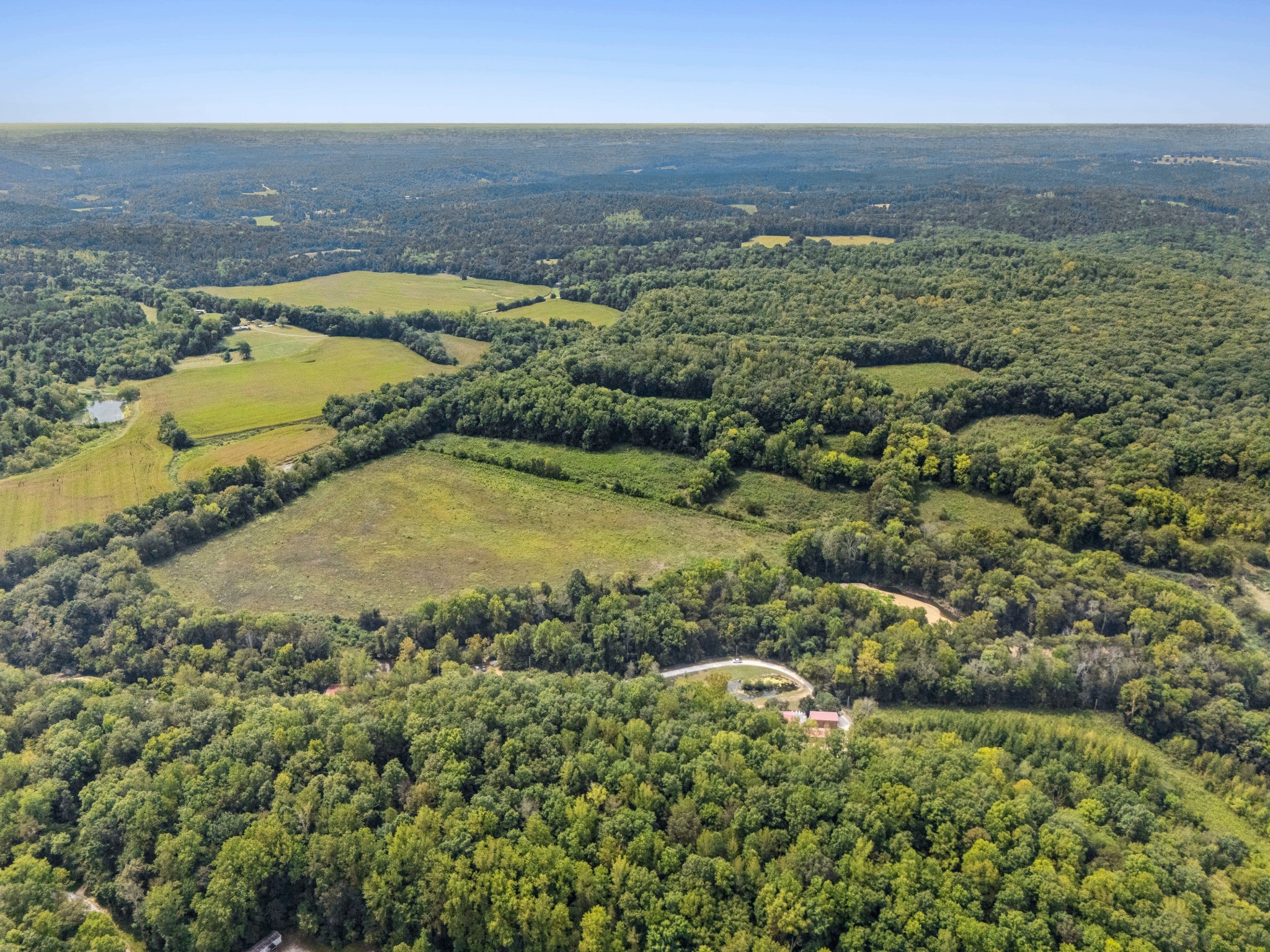 299 Natural Bridge Park Road Waynesboro, TN 38485 - Photo 37 of 63 an aerial view of residential houses with outdoor space