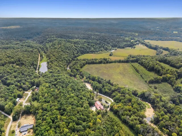 a view of a swimming pool with a yard