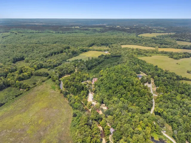 a view of a swimming pool with a backyard
