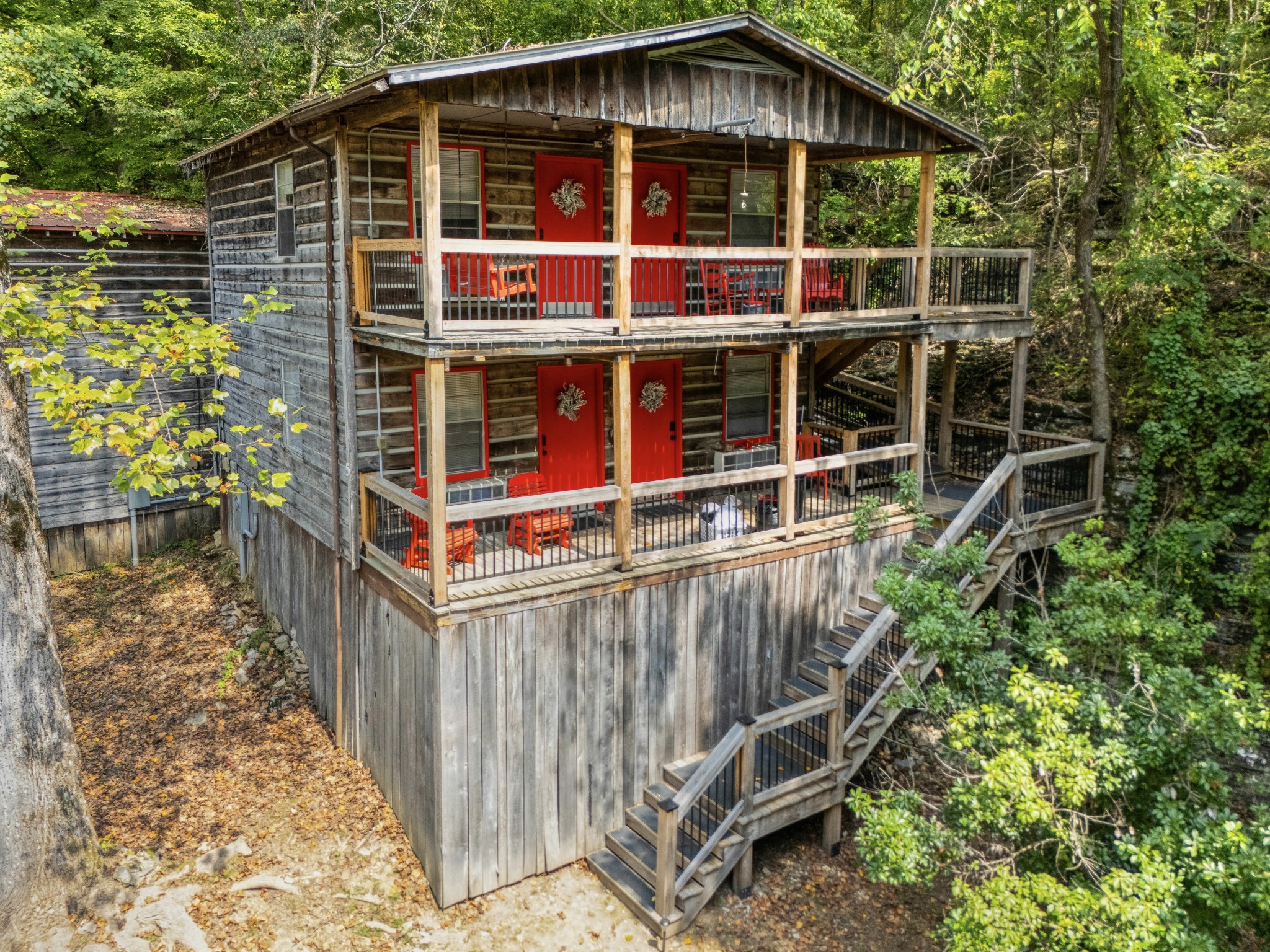 299 Natural Bridge Park Road Waynesboro, TN 38485 - Photo 51 of 63 a view of a wooden house with a small yard and wooden fence
