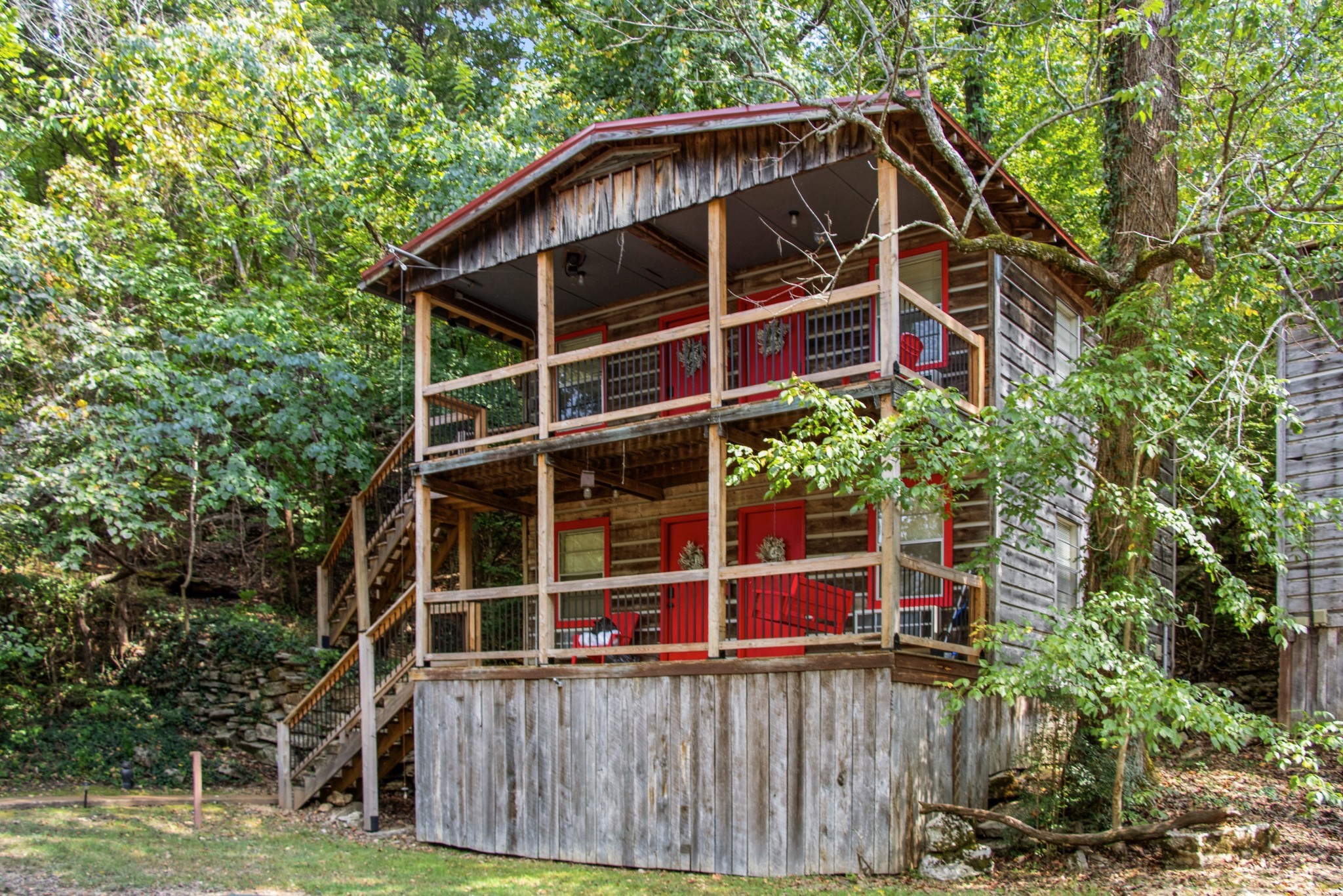 299 Natural Bridge Park Road Waynesboro, TN 38485 - Photo 54 of 63 a front view of a house with a yard and potted plants