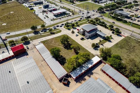 an aerial view of a residential houses with outdoor space
